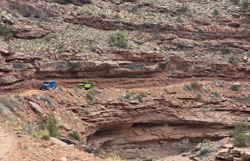 A mountain road with cars passing through